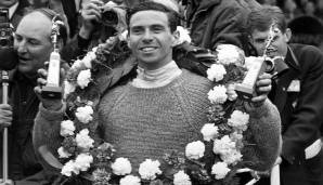 Platz 9, Jim Clark (25 Siege in 72 Rennen): Wie 1965 üblich gibt's für den Gewinner einen dicken Siegerkranz. Hier jubelt der Schotte nach seinem Triumph beim Großbritannien-GP.