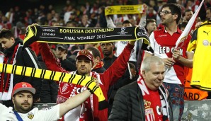 Während die Fans im Stadion auf genauere Informationen warteten, solidarisierten sich die Monaco-Fans mit den Dortmundern