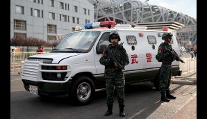 Das Pekinger Vogelnest und Nationalstadion wird streng bewacht