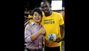 TAG 2: Der Star-Pianist Lang Lang feiert mit Usain Bolt den WM-Titel