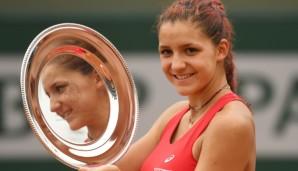 PARIS, FRANCE - JUNE 05: Champion Rebeka Masarova of Switzerland poses with the trophy following her victory during the Girls Singles final match against Amanda Anisimova of the United States on day fifteen of the 2016 French Open at Roland Garros o...