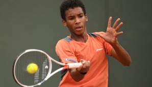 PARIS, FRANCE - JUNE 05: Felix Auger Aliassime of canada hits a forehand during the Boys Singles final match against Geoffrey Blancaneaux of France on day fifteen of the 2016 French Open at Roland Garros on June 5, 2016 in Paris, France. (Photo by ...